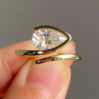 /public/photos/live/East West Pear Moissanite Open Bezel Set Bypass Engagement Ring 965 (2).webp